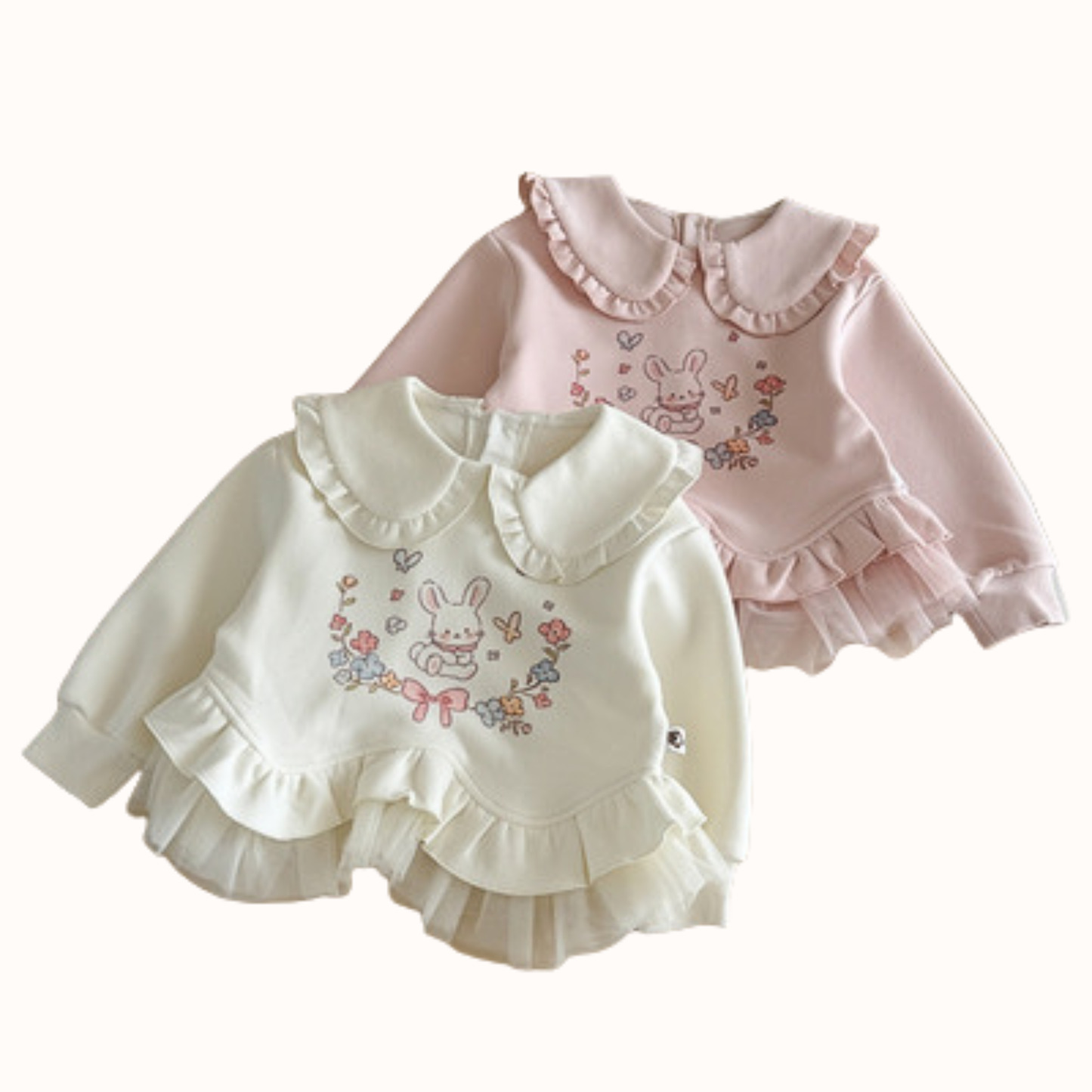 Two Bunny Frill Sweatshirts in cream and pink with frill collars and cute bunny graphic print for girls, CHÉRUBI kidswear.