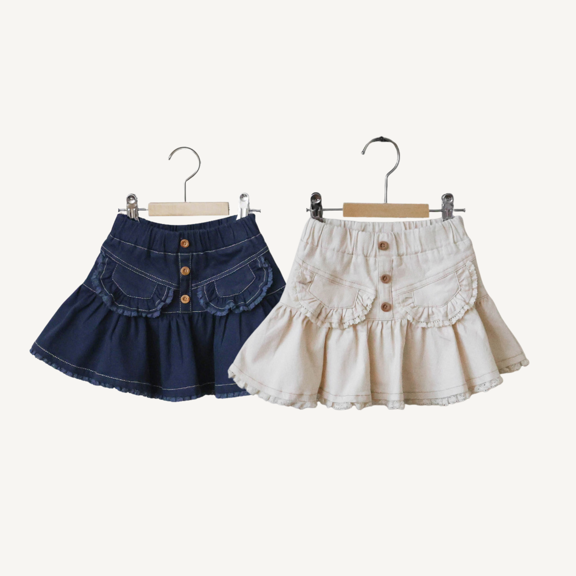 Kids denim skirt in cream and navy with soft flare silhouette and elastic waistband — CHÉRUBI Kidswear.