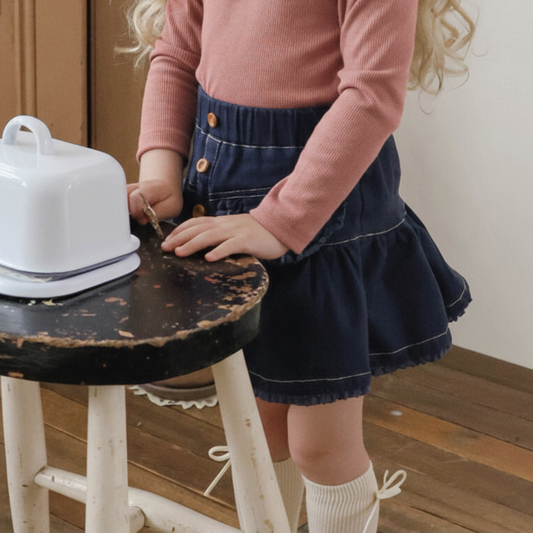 Kids denim skirt in cream and navy with soft flare silhouette and elastic waistband — CHÉRUBI Kidswear.
