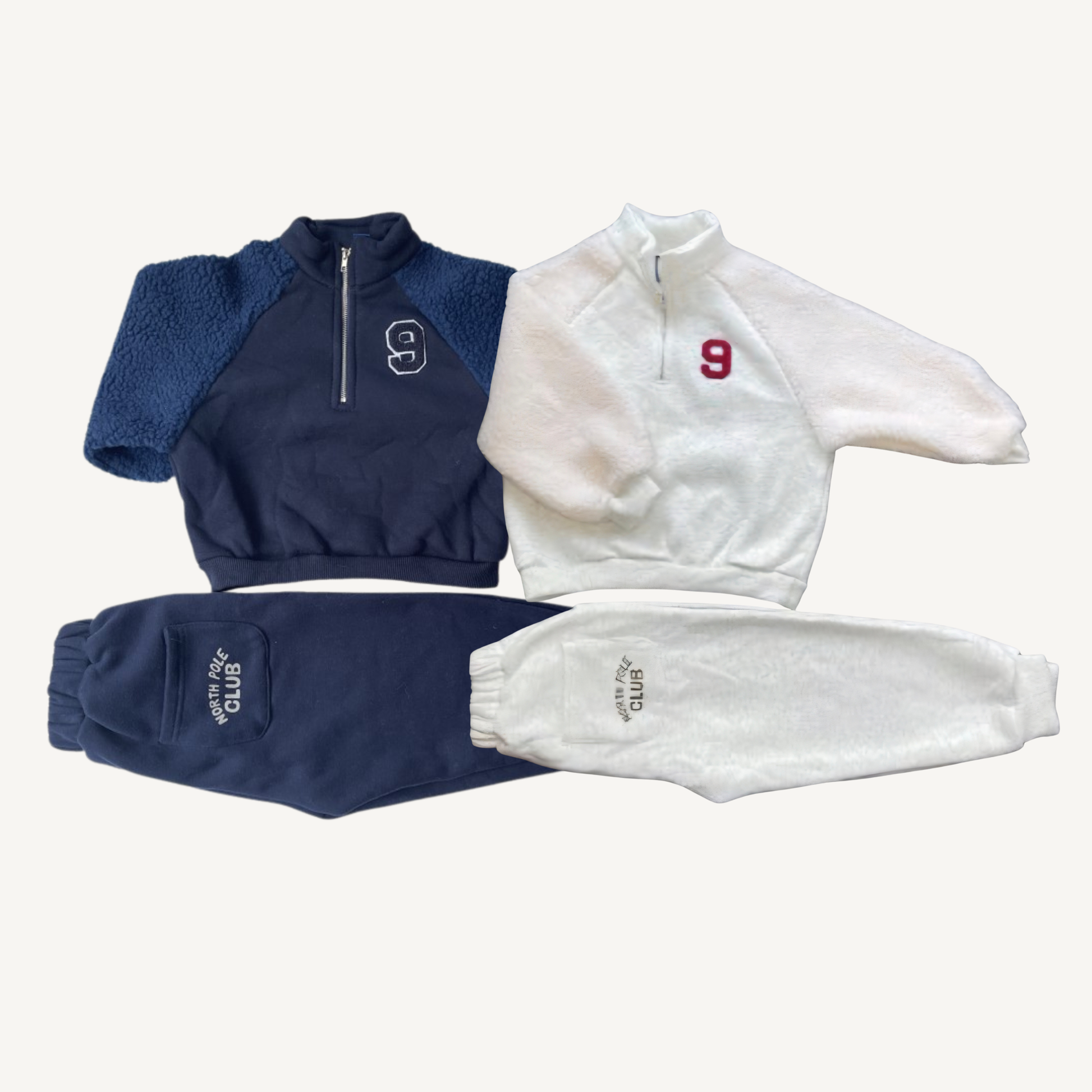 fleece jogger sets in navy blue and ivory, featuring half-zip tops with number 9 embroidery and matching jogger pants, laid flat on a white background.